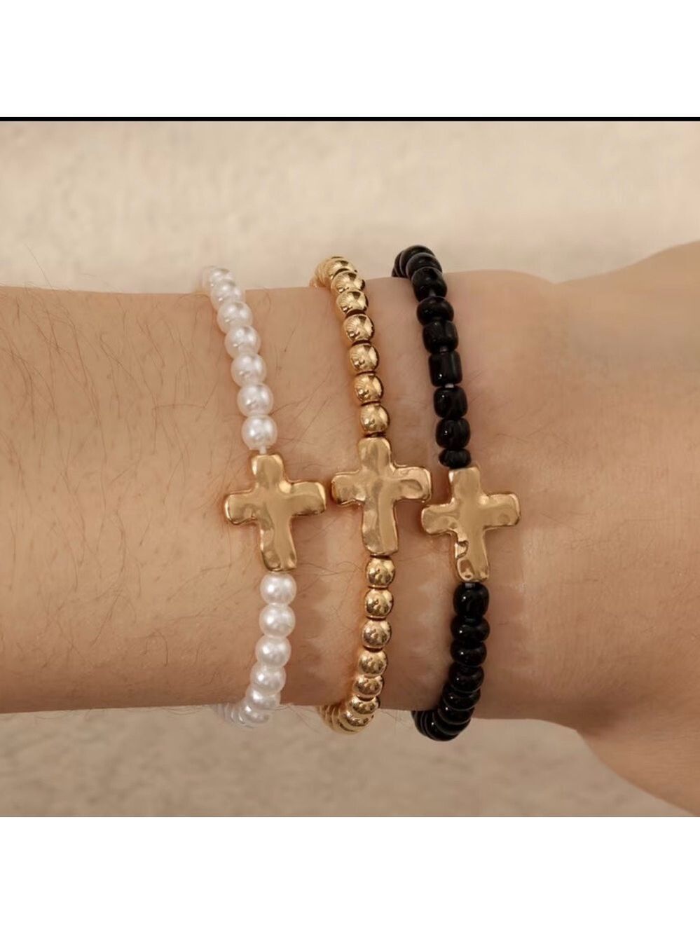 Elegant Gold, Black, and White Cross Bracelets